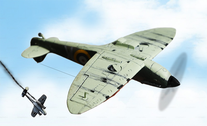 A studio photograph of a 1/72 Spitfire Mk1a model kit